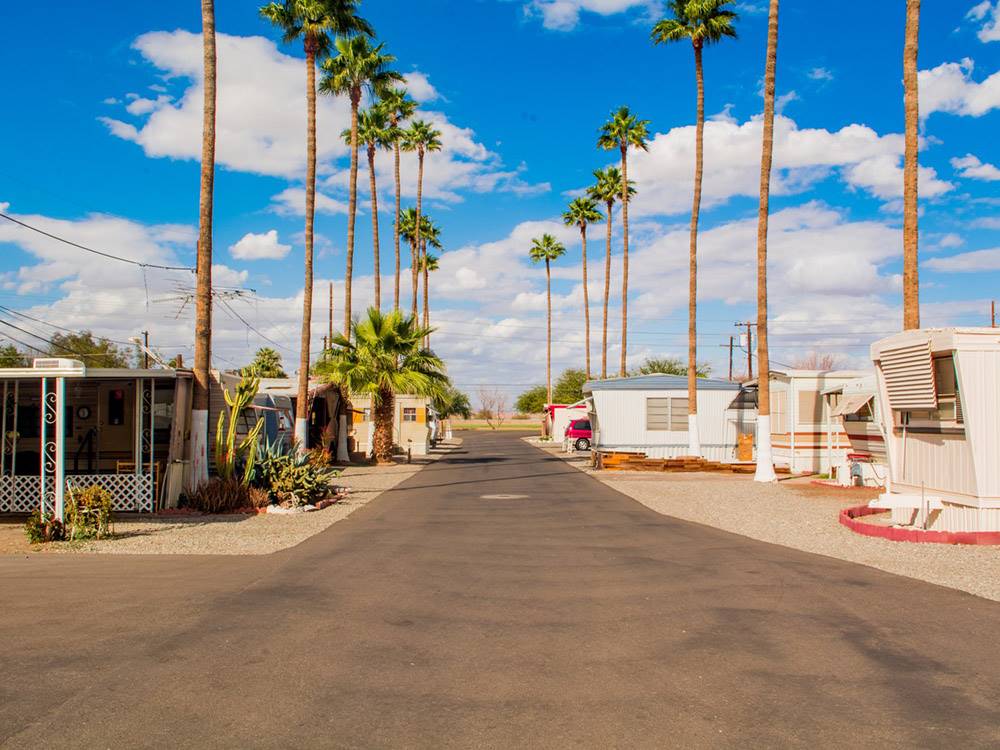 Road leading through park model neighborhood at GOLDWATER MOBILE HOME & RV PARK