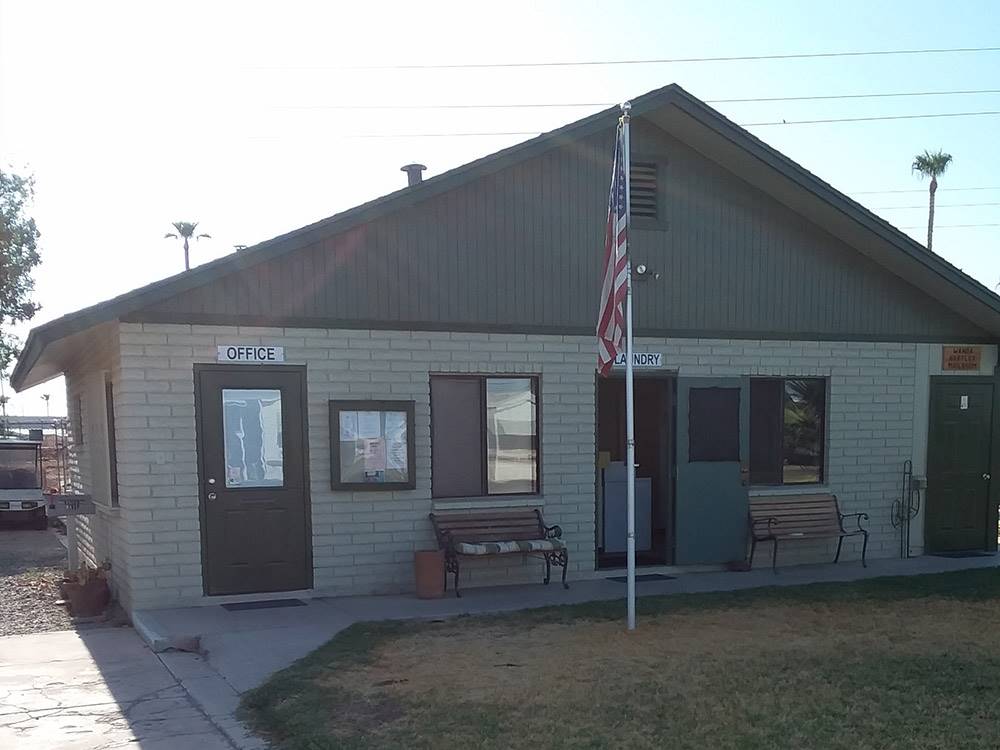 Brick campground office with American flag at GOLDWATER MOBILE HOME & RV PARK