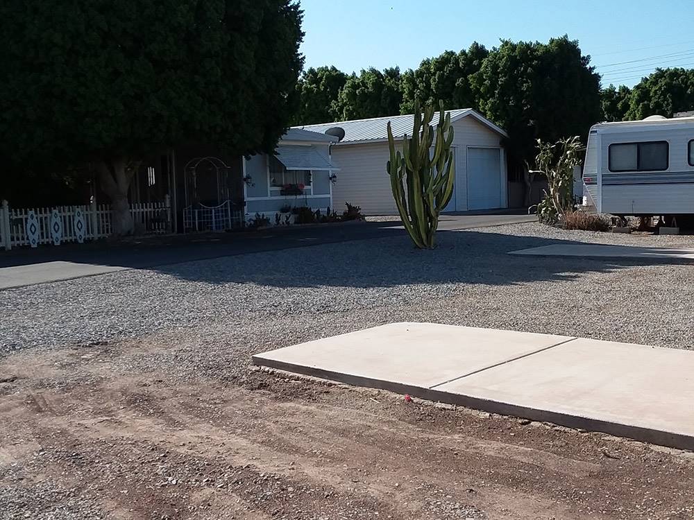 Gravel Campground site with patio at GOLDWATER MOBILE HOME & RV PARK