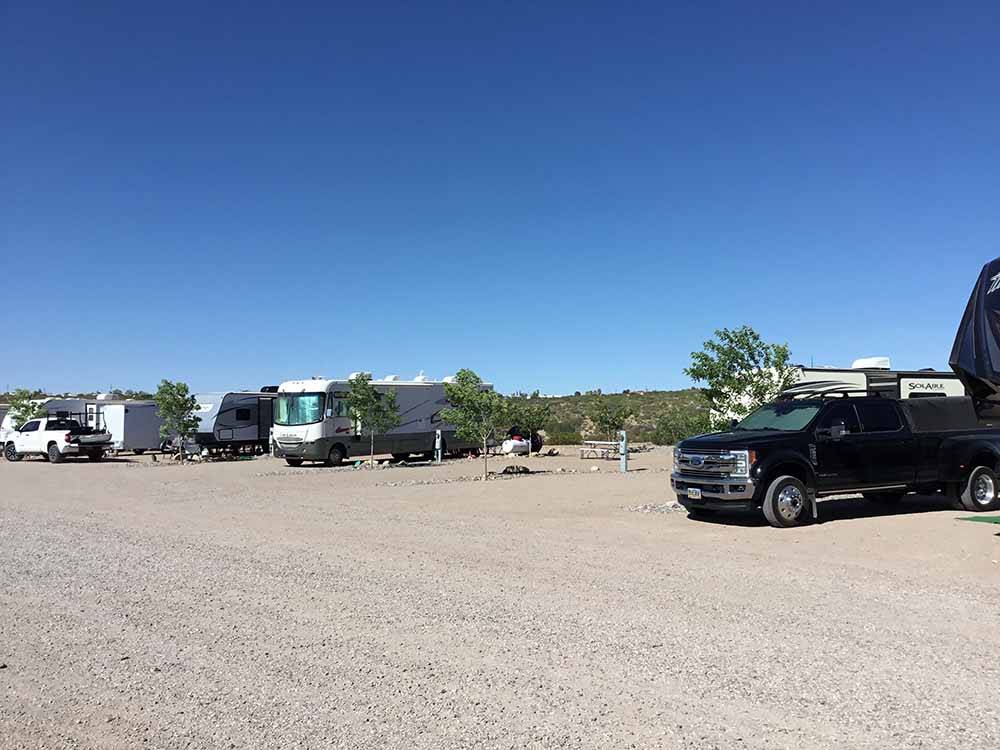 A row of gravel RV sites at DESERT VIEW RV PARK
