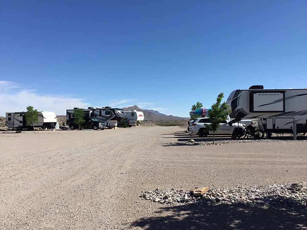 A gravel road going between RV sites at DESERT VIEW RV PARK