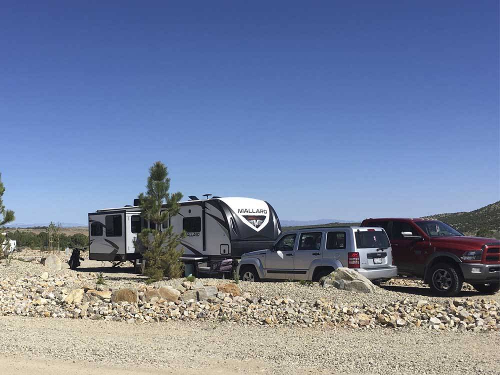 A row of gravel RV sites at IRON SPRINGS ADVENTURE RESORT