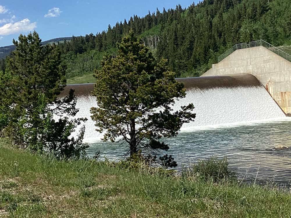 Water cascades over dam in river at RED EAGLE CAMPGROUND