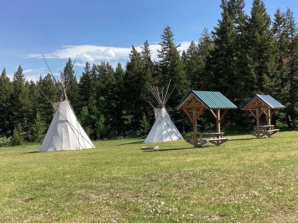 Two teepees with picnic tables at RED EAGLE CAMPGROUND