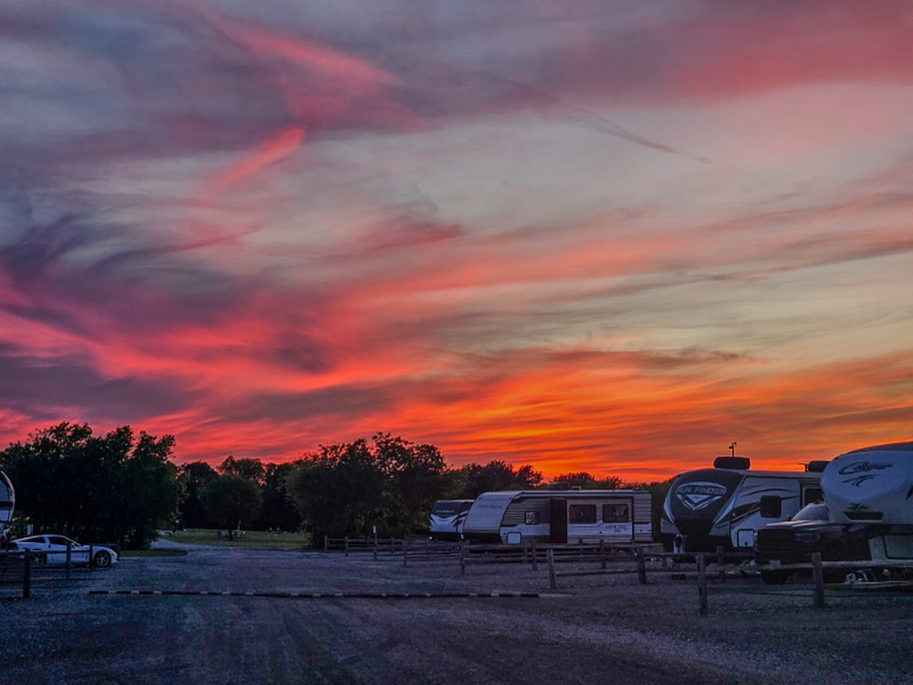 RVs parked in sites at sunset