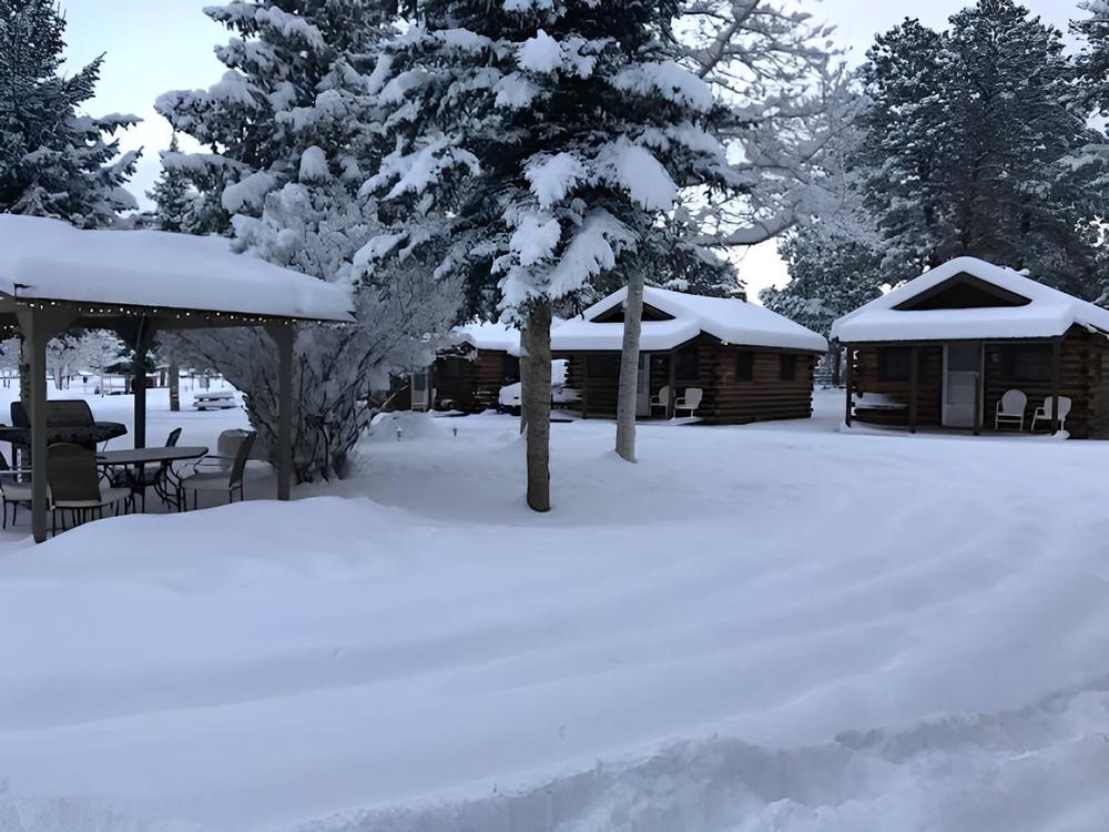 Cabins and pavilion covered in snow