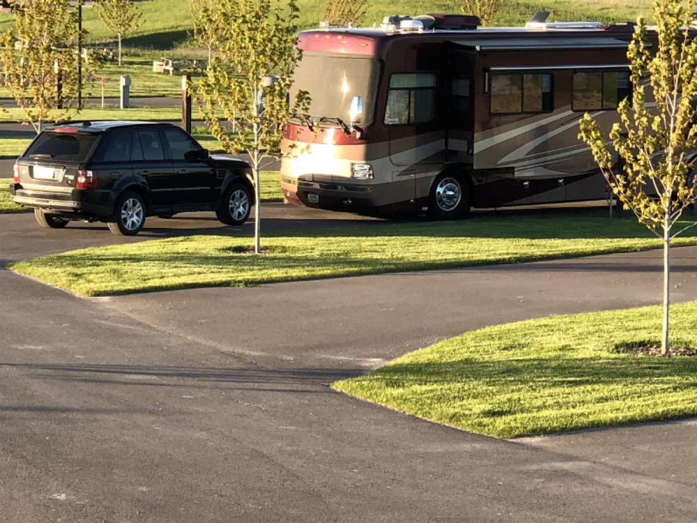 RV and black SUV in site at Montana Basecamp