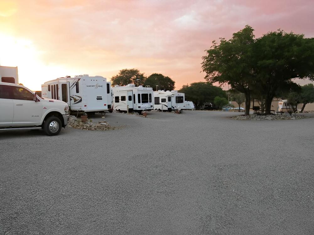 RVs in campsites at sunset
