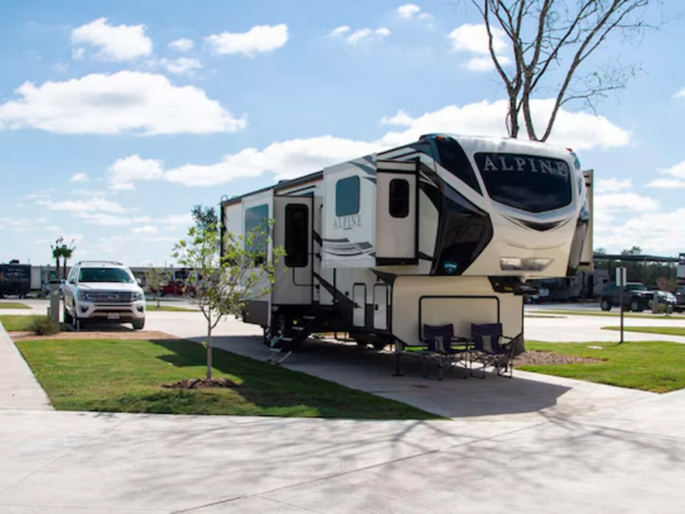 Camper on paved site Space City Ellington