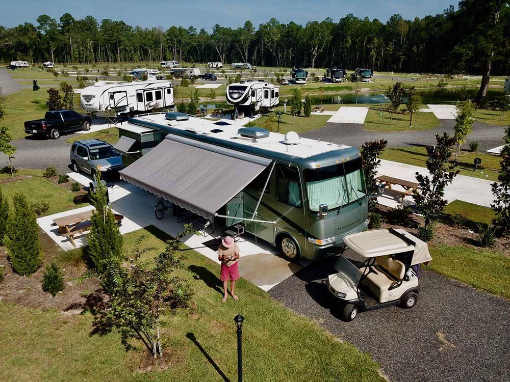 A motorhome in a paved RV site at MADISON RV  GOLF RESORT