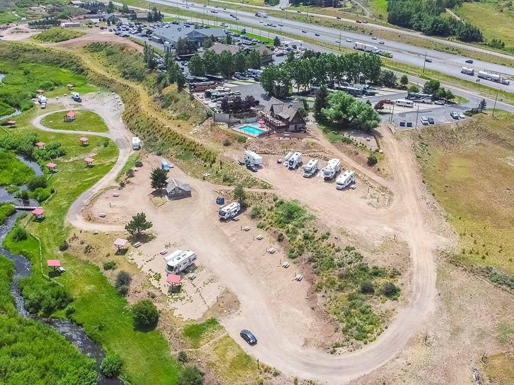Aerial view of campground and creek at PARK CITY RV RESORT
