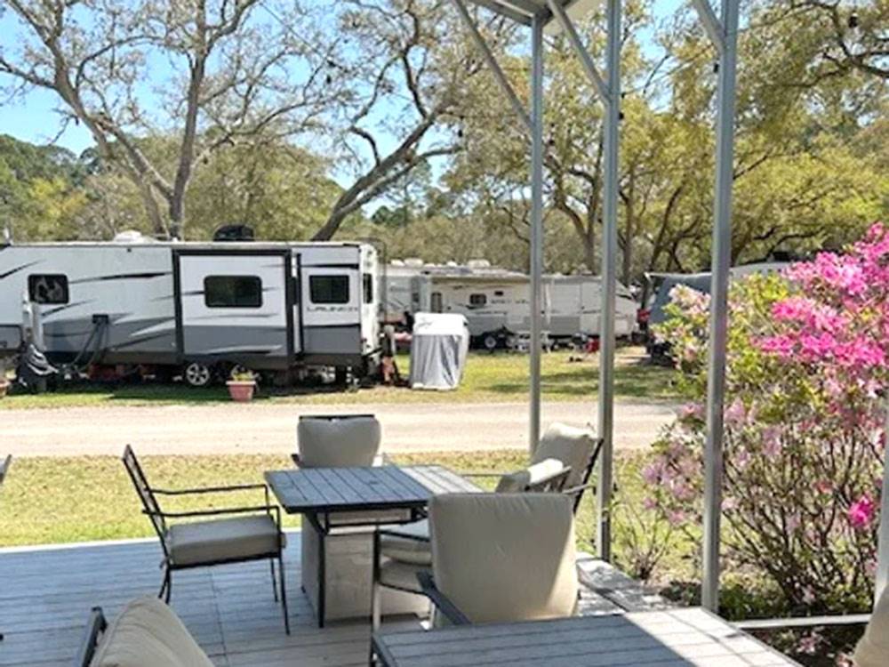 Patio tables and chairs under covered deck at Panacea RV Park