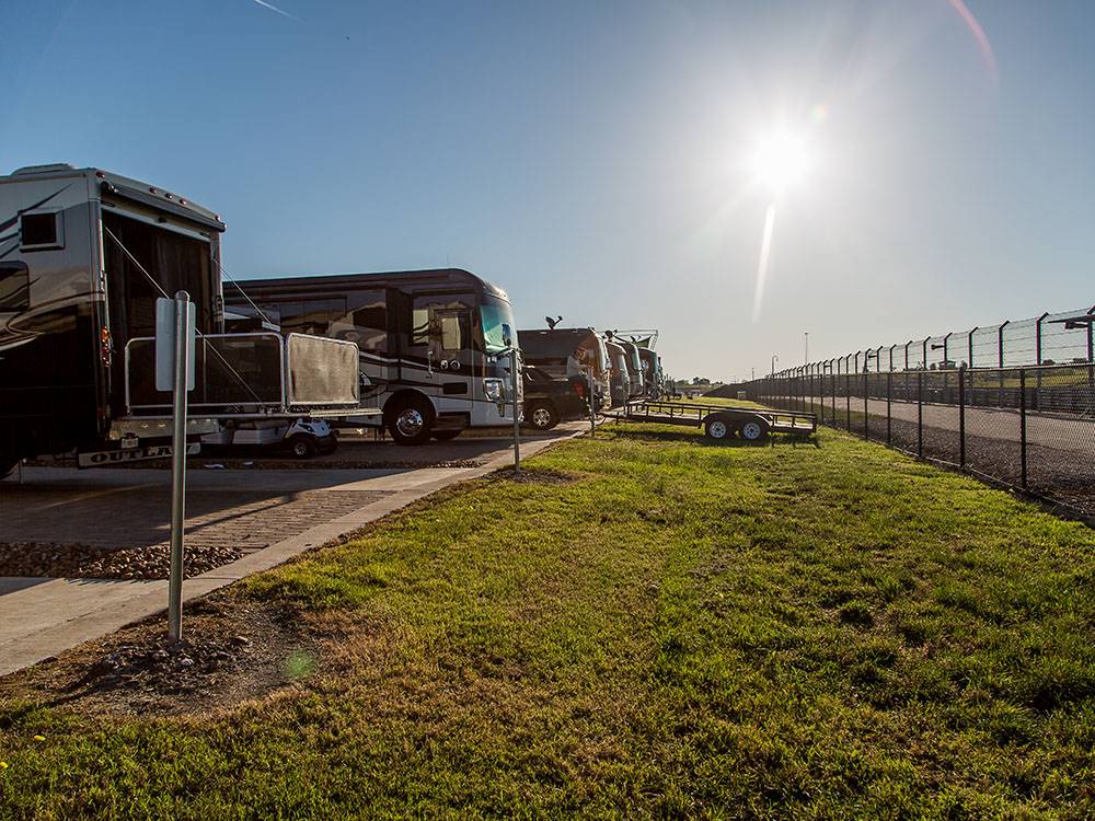 Motorhomes and trailers parked in paved sites at COTA CAMPING-PREMIUM RV PARK