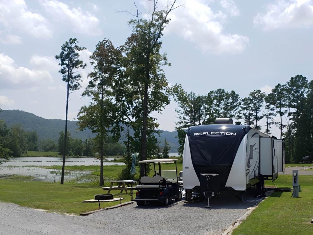 Sites by a small pond at Greensport RV Park & Campground