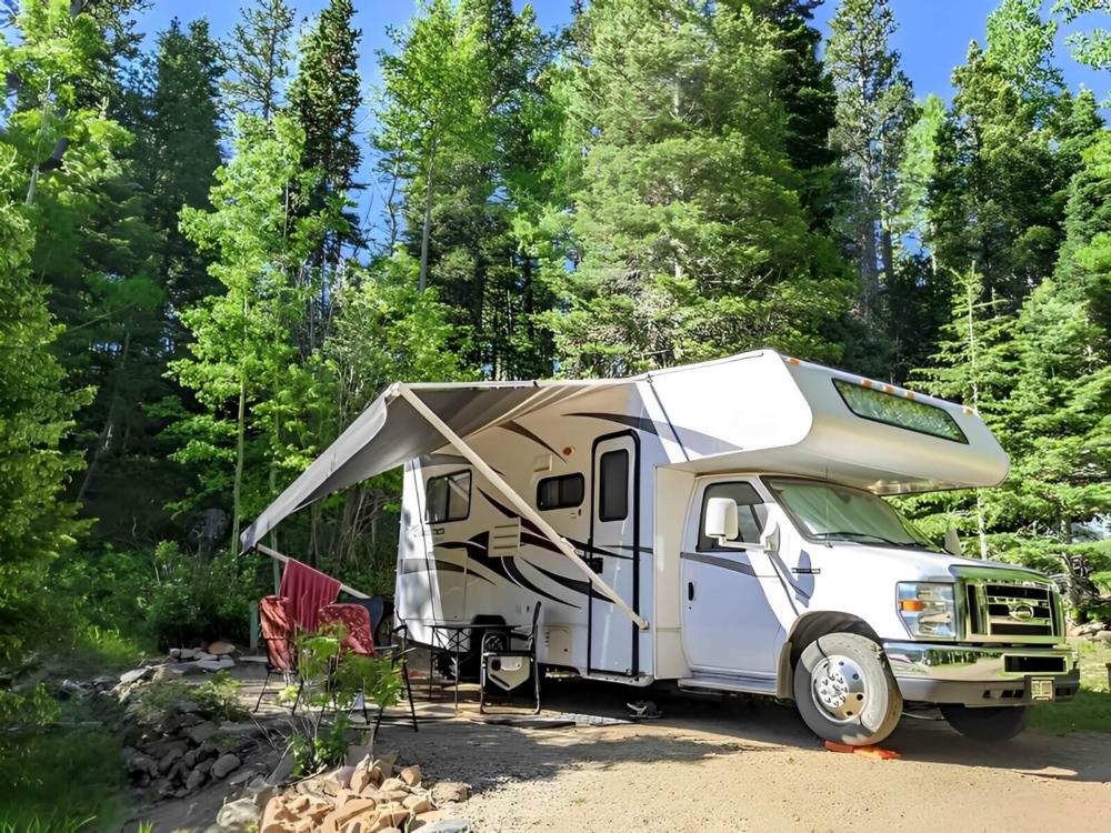 RV parked at site Aspen Acres Campground