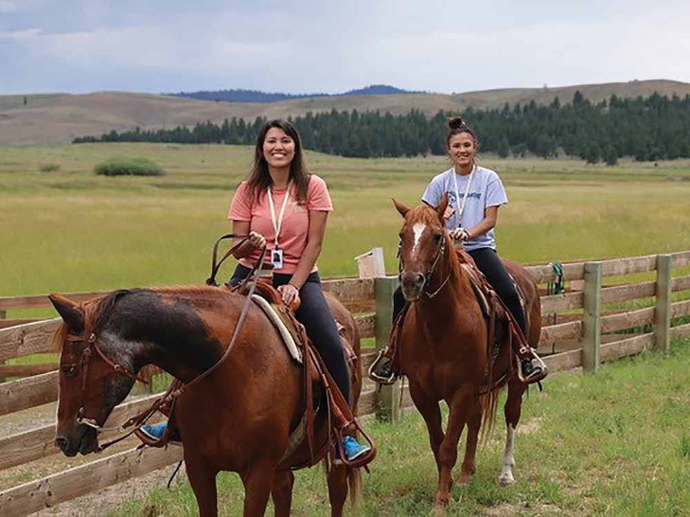 Two young ladies riding horses at THE RETREAT, LINKS & SPA AT SILVIES VALLEY RANCH