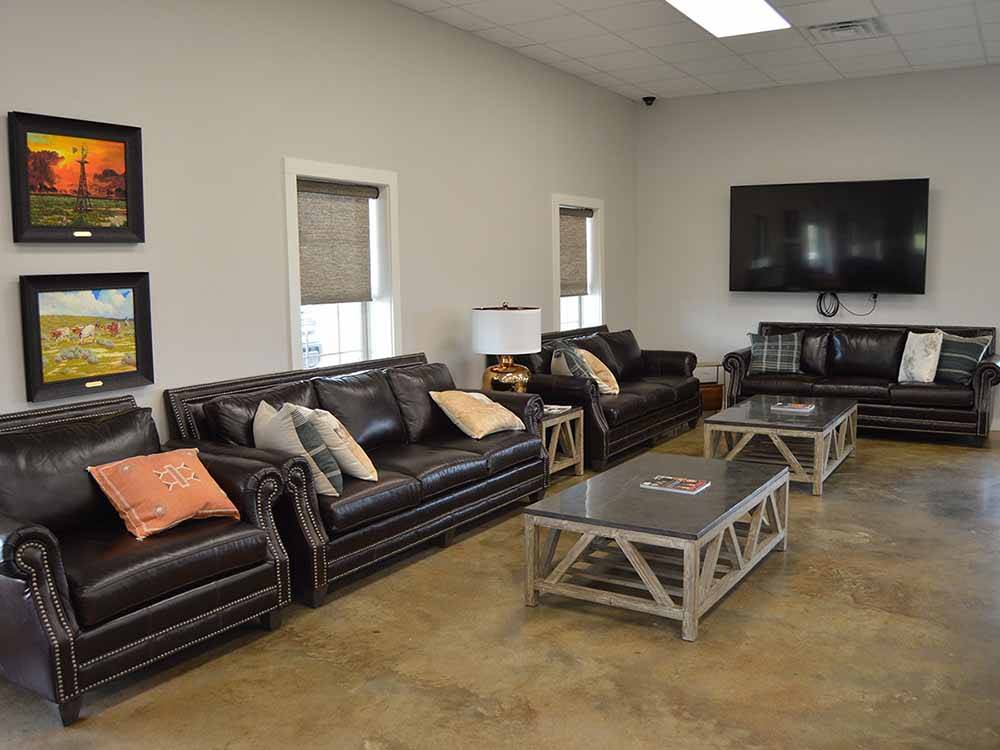 Inside sitting area with couches at BRAZOS TRAIL RV PARK