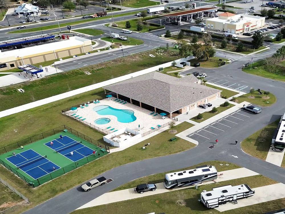 Aerial view of pool and pickleball courts