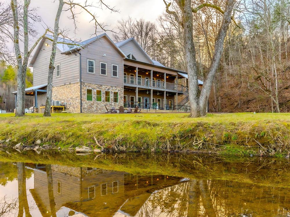 Back of clubhouse with water view at APPALACHIAN SPRINGS OUTDOOR RESORT