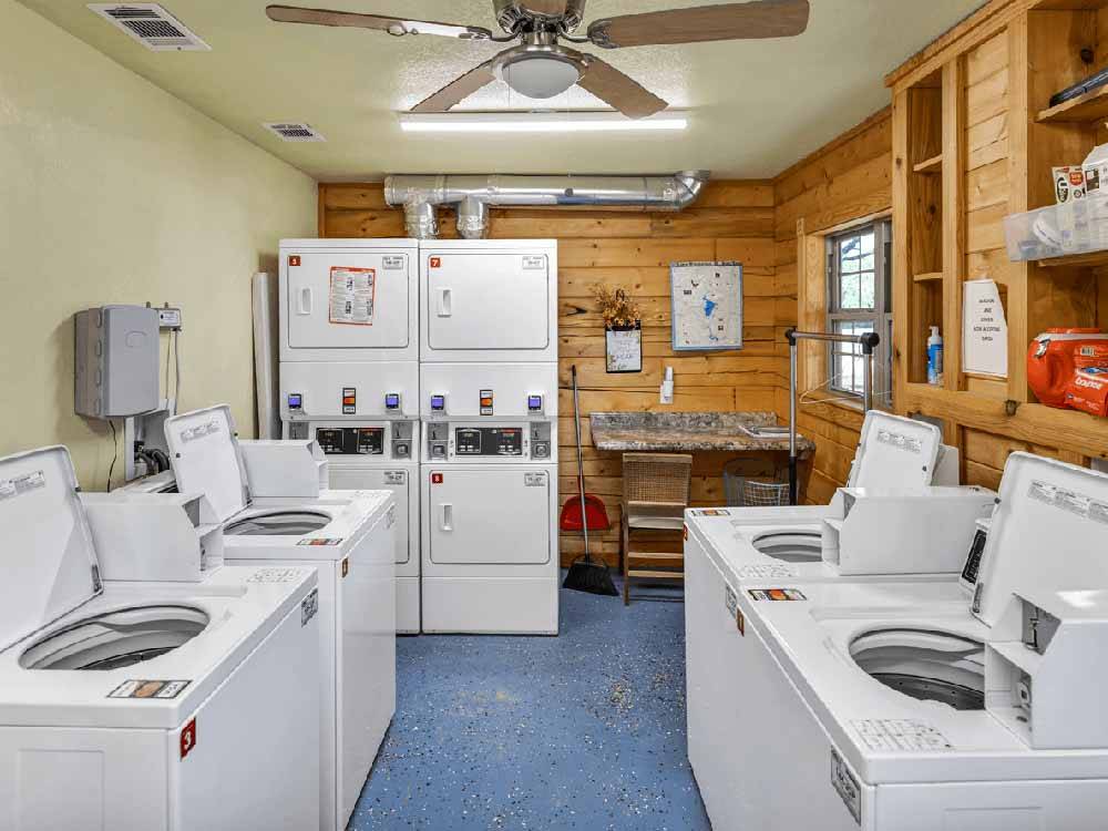 A group of washers and dryers at FREEDOM LIVES RANCH RV RESORT