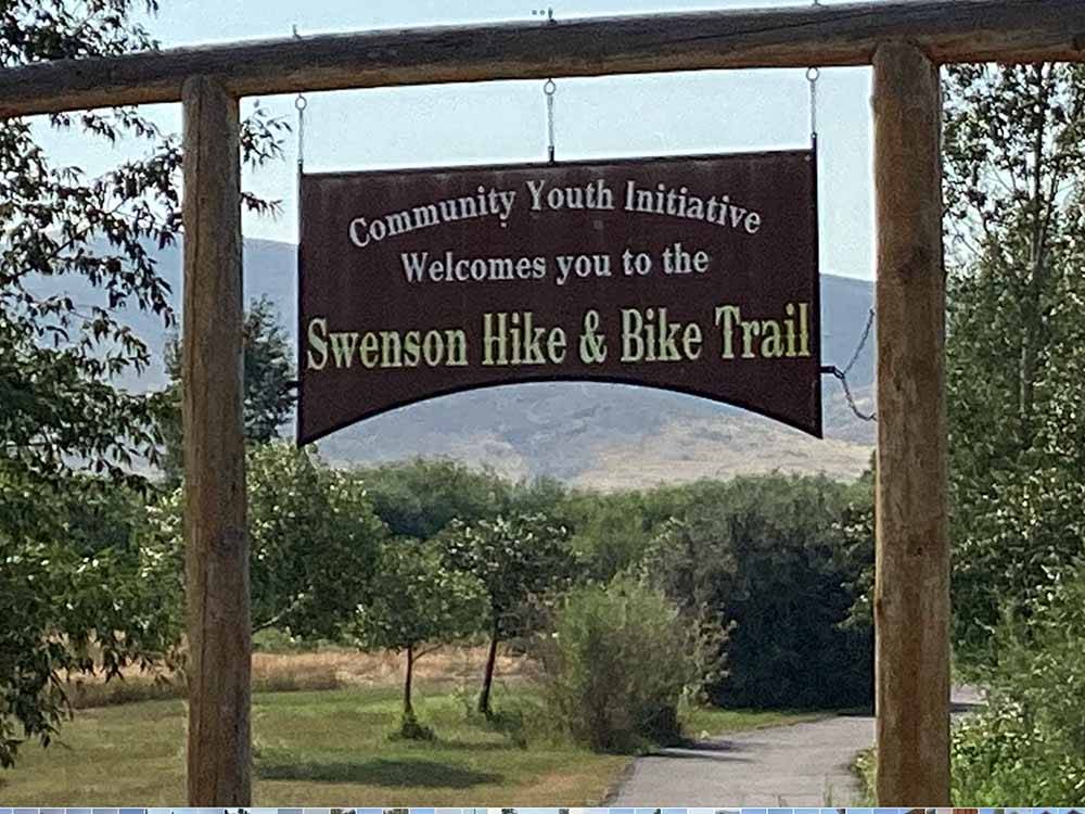 A sign for the Swenson Hike & Bike Trail nearby at DILLON MOTORCOACH & RV PARK