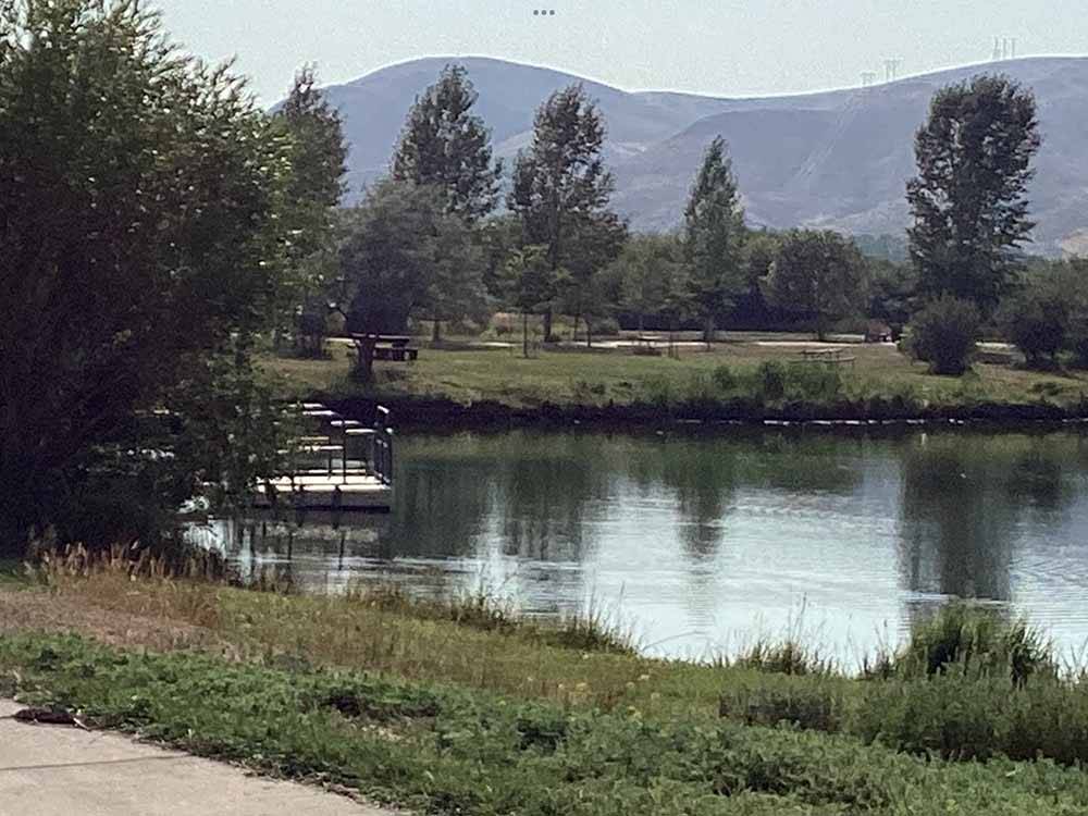 The water with a fishing dock at DILLON MOTORCOACH & RV PARK