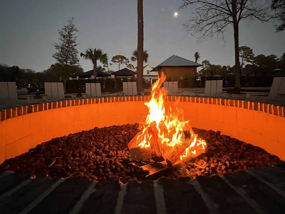 Firewood burning in the fire pit at HILTON HEAD NATIONAL RV RESORT