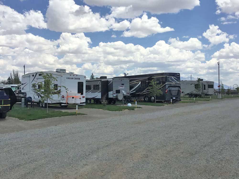 A row of gravel RV sites at COOL SUNSHINE RV PARK