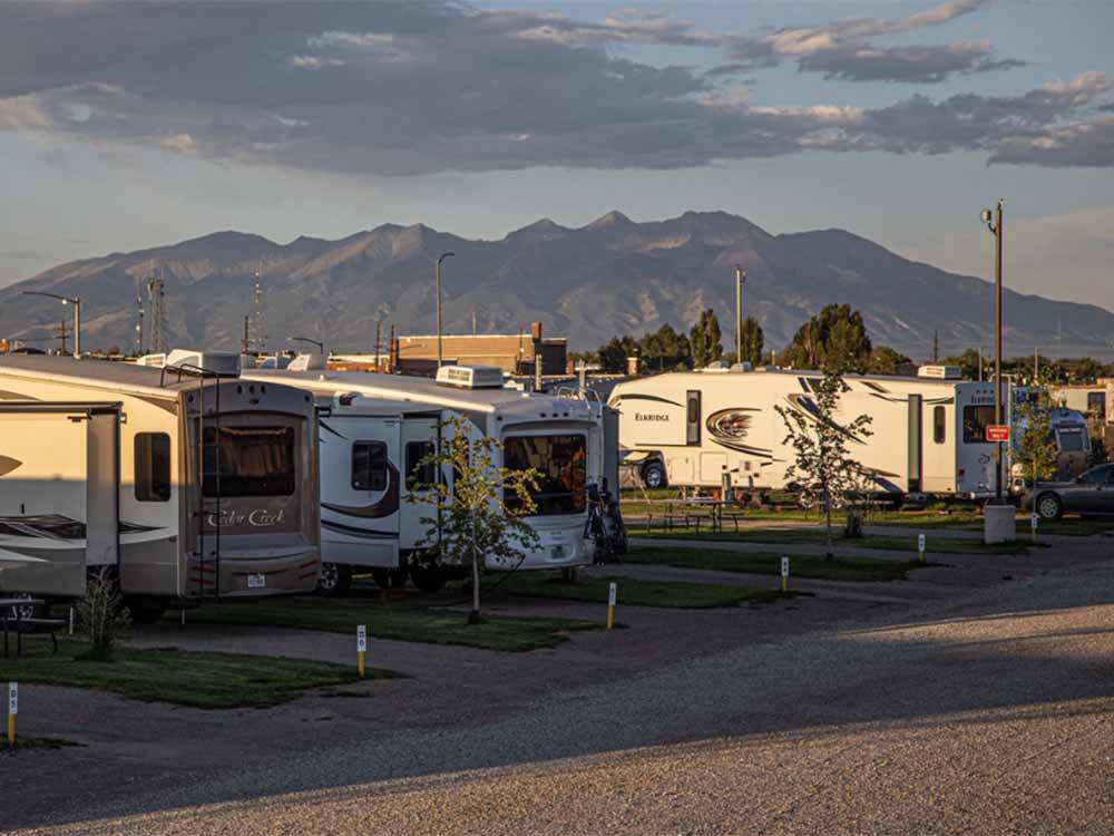 A row of gravel RV sites at COOL SUNSHINE RV PARK