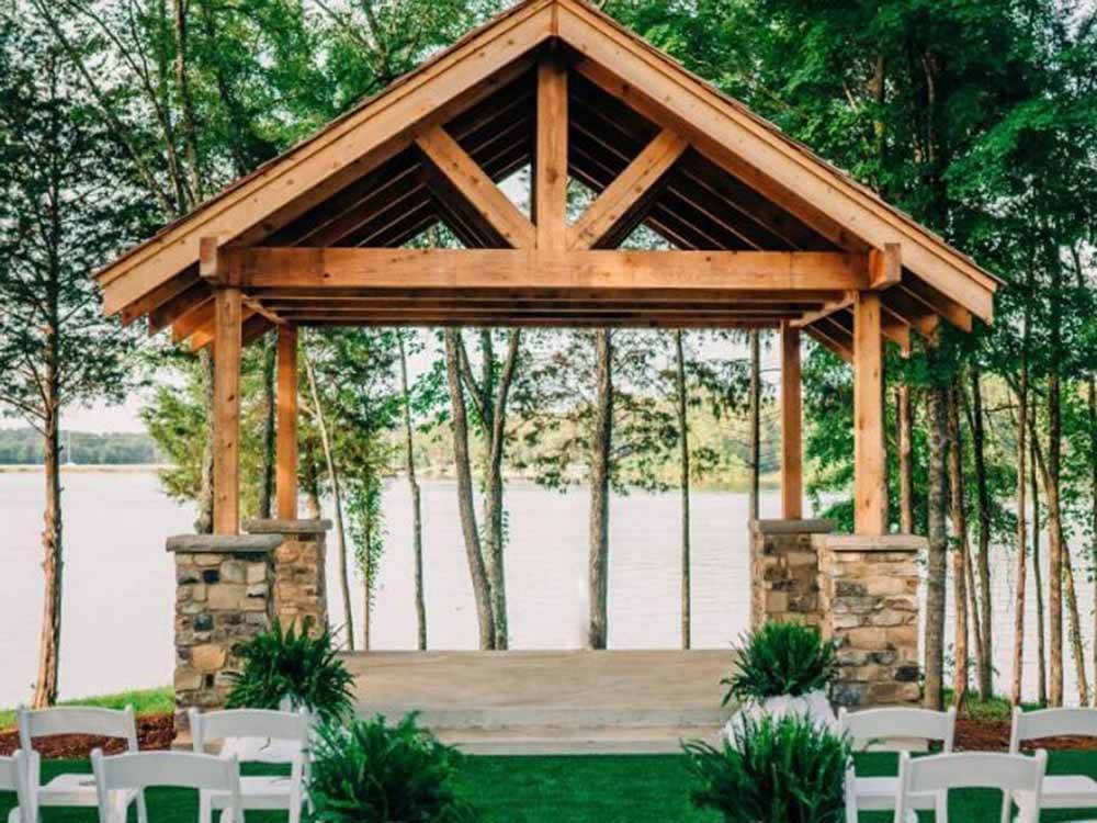 A wooden pavilion overlooking the water at TWIN CREEKS RV RESORT