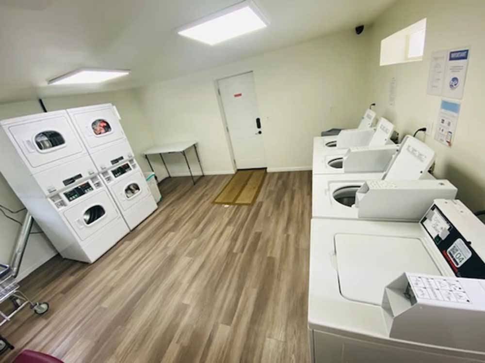 Laundry area with dryers and washing machines at SUNNY OAKS RV PARK