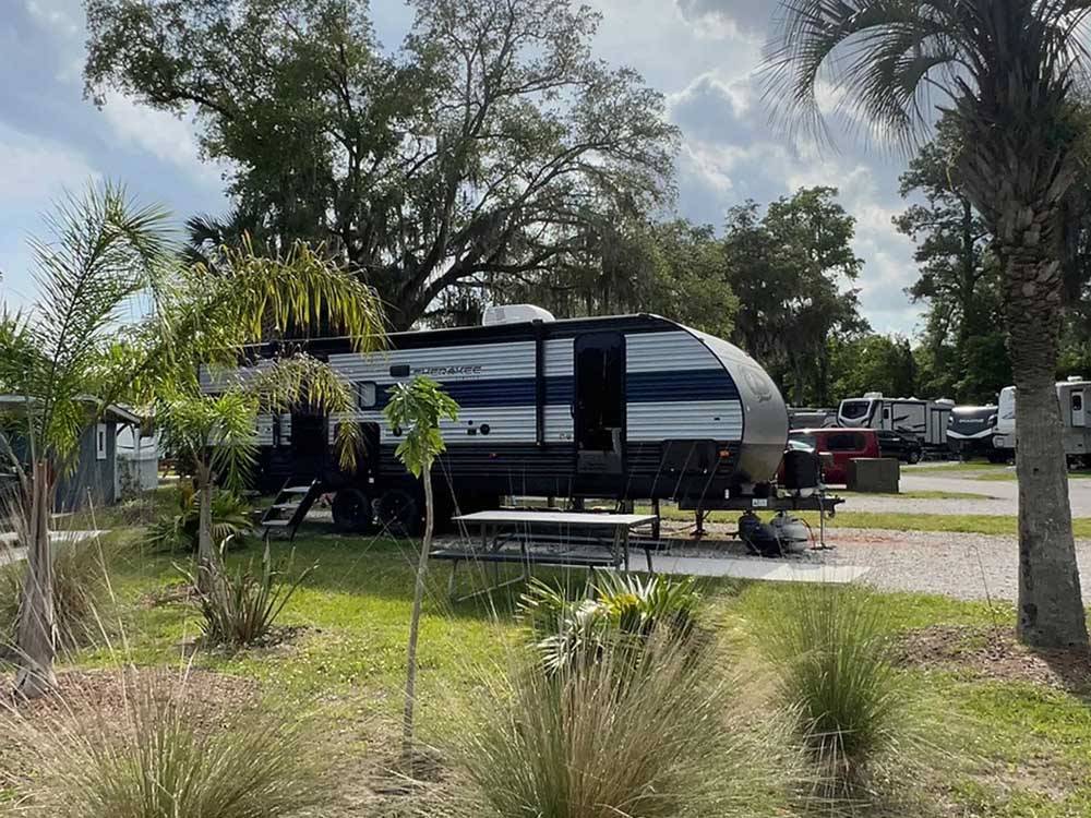 Another trailer parked in a RV site at SUNNY OAKS RV PARK