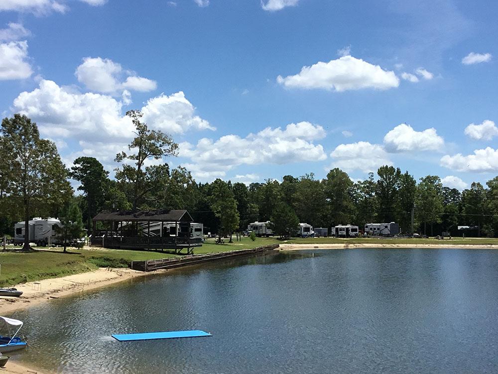 RV sites at the edge of the lake at THOMPSON LAKE RV RESORT