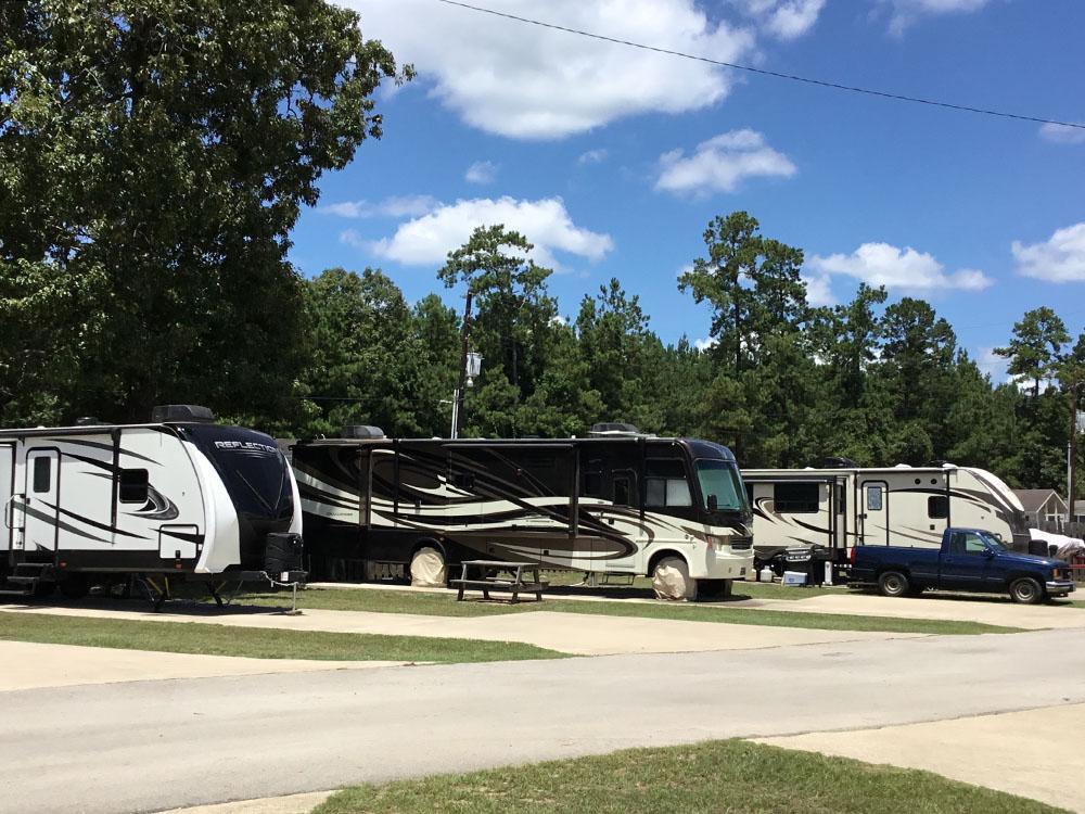 Class A motorhome in paved sites at THOMPSON LAKE RV RESORT