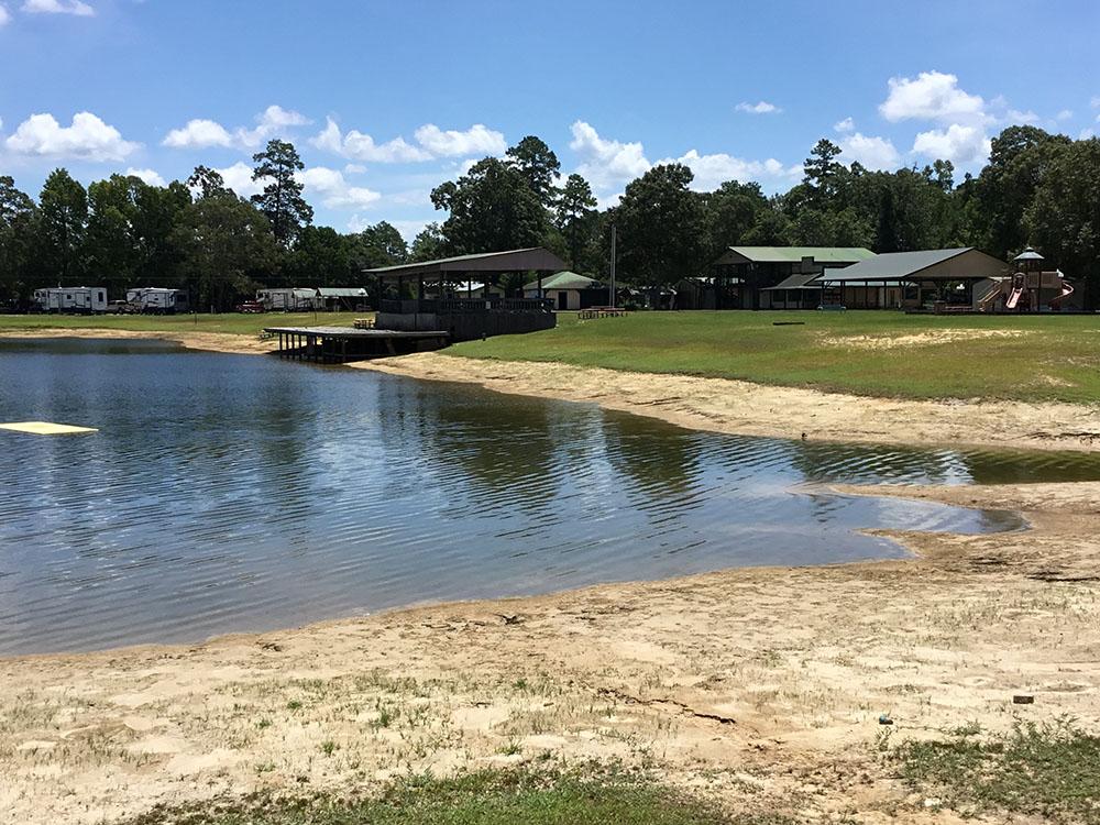 A view of the pavilion across the lake at THOMPSON LAKE RV RESORT