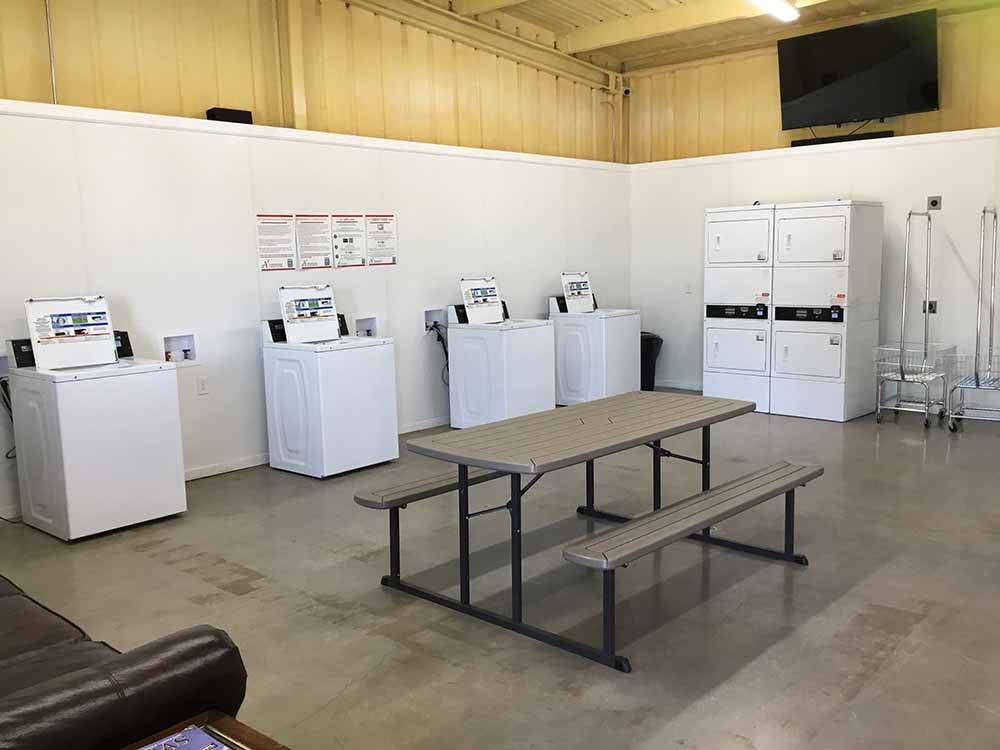 Washers and dryers in the laundry room at SUNDANCE RV PARK