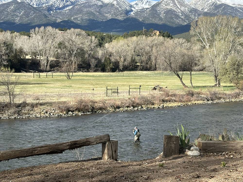 A man fly fishing in the river