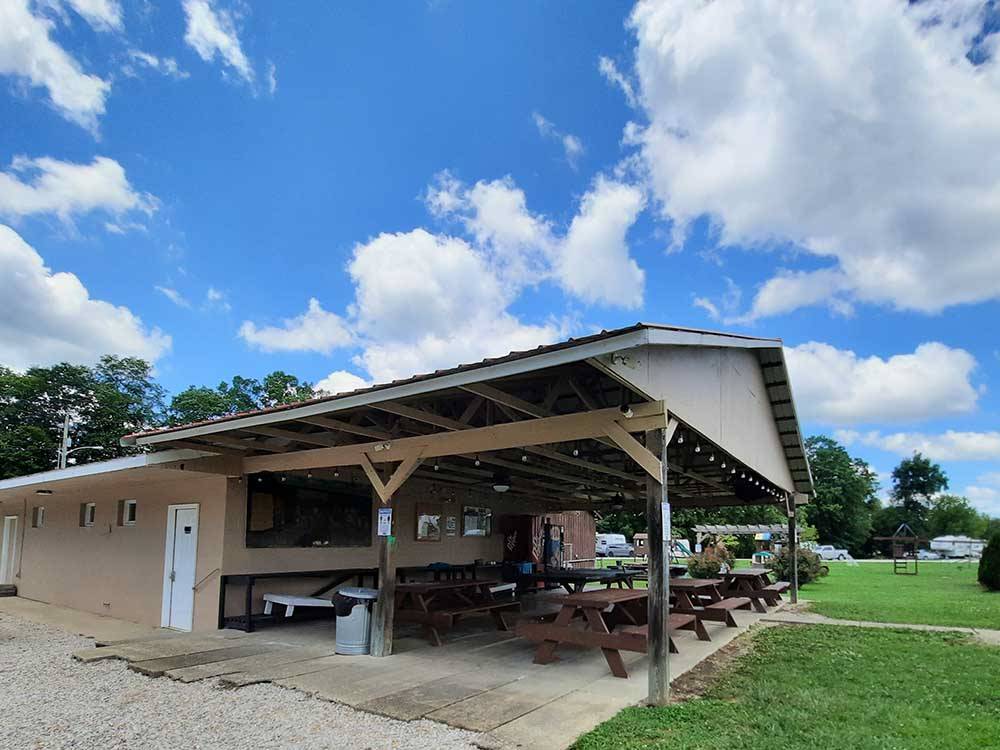 Pavilion with picnic tables at OUTPOST RV PARK & CAMPGROUND