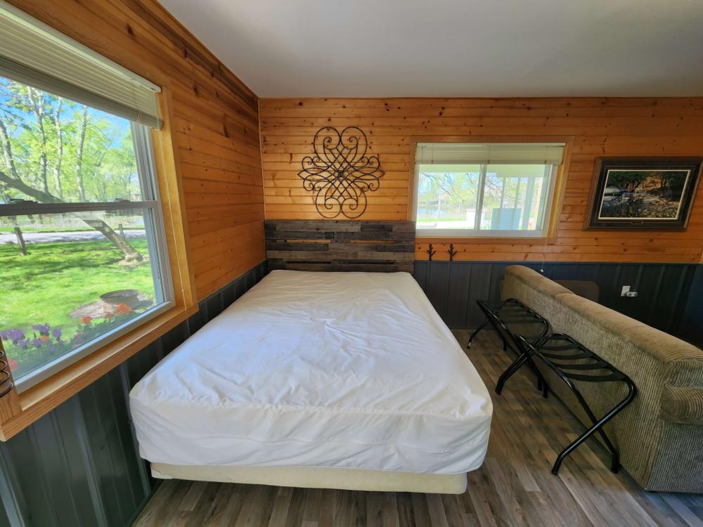Bed inside cabin at 	Lake Road Campground