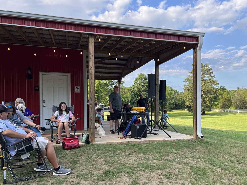 A group of people getting ready to listen to music at LAKE THURMOND RV PARK