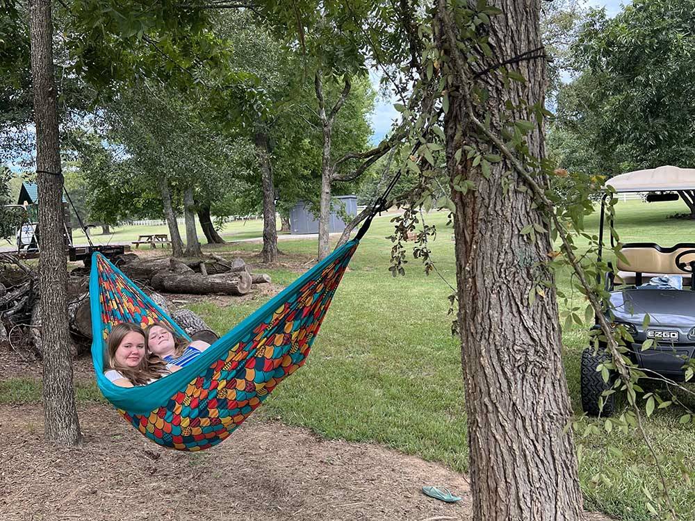 Two girls in a hammock at LAKE THURMOND RV PARK