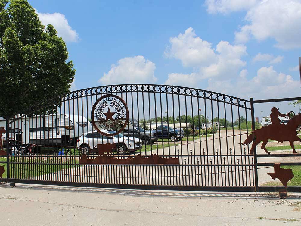 The front metal gate entrance at CREEKSIDE RV RANCH