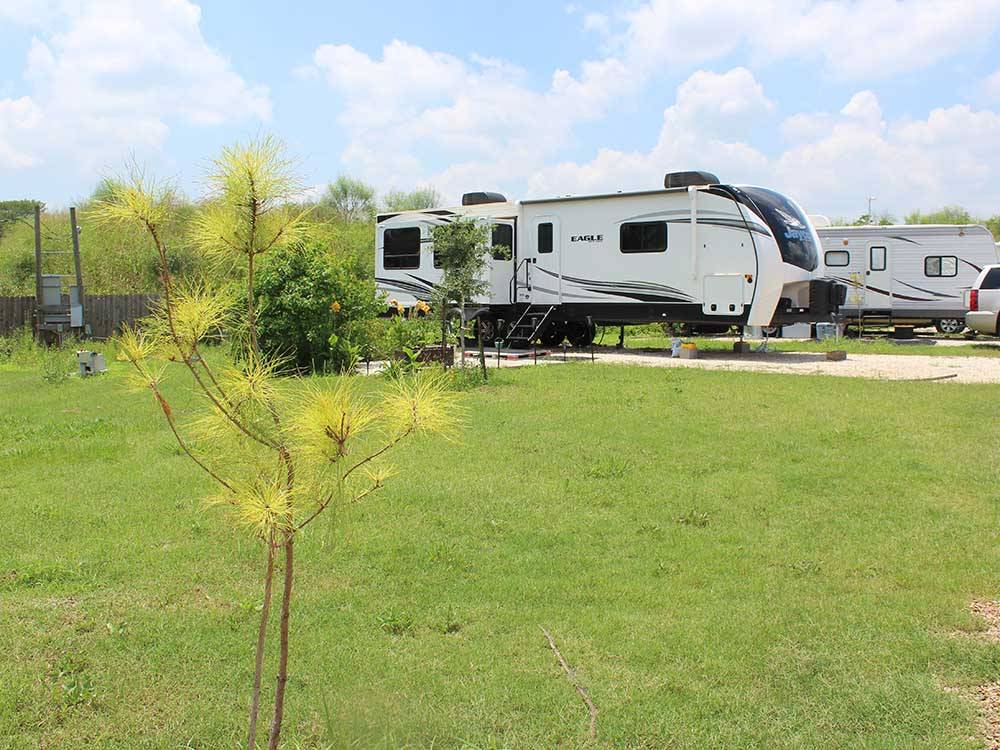 Trailers parked in gravel sites at CREEKSIDE RV RANCH