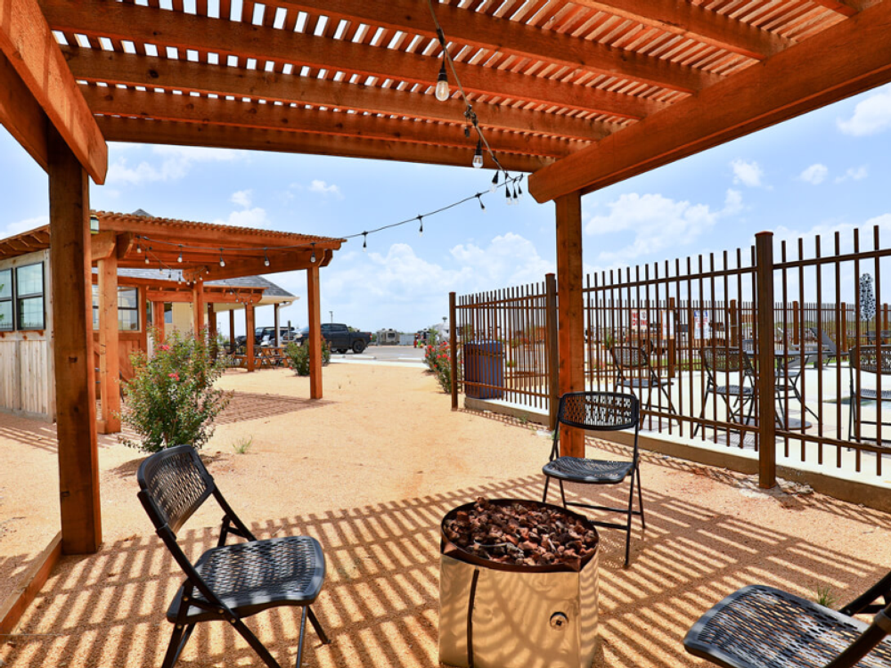 Covered seating area by the pool at Ridgeview RV Resort