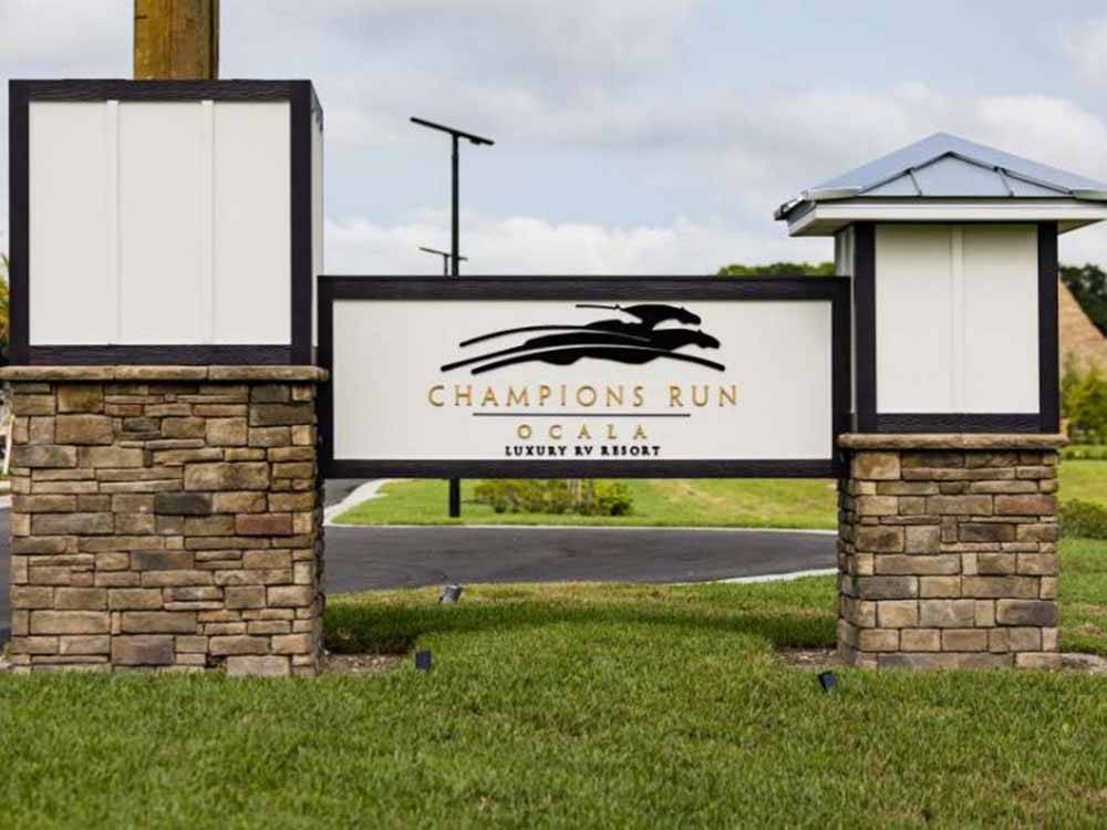 The front entrance sign at CHAMPIONS RUN LUXURY RV RESORT