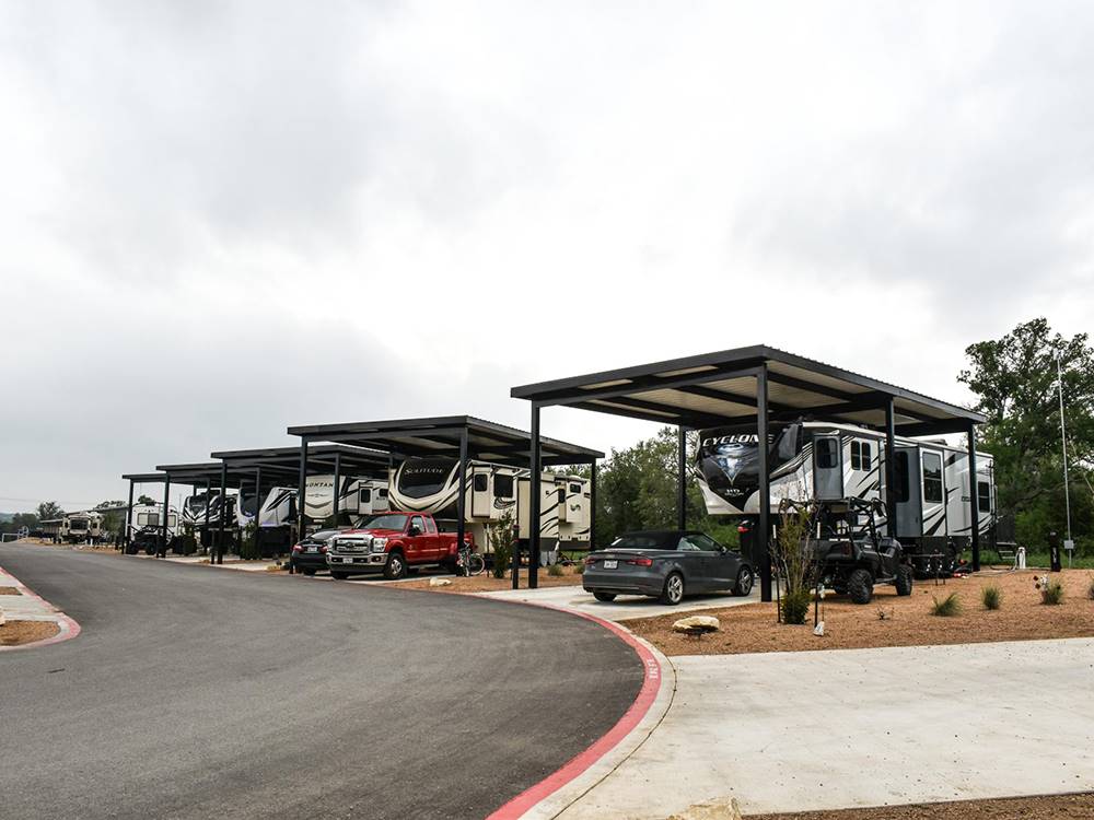 A row of covered paved sites at Jetstream RV Resort at Stone Oak Ranch