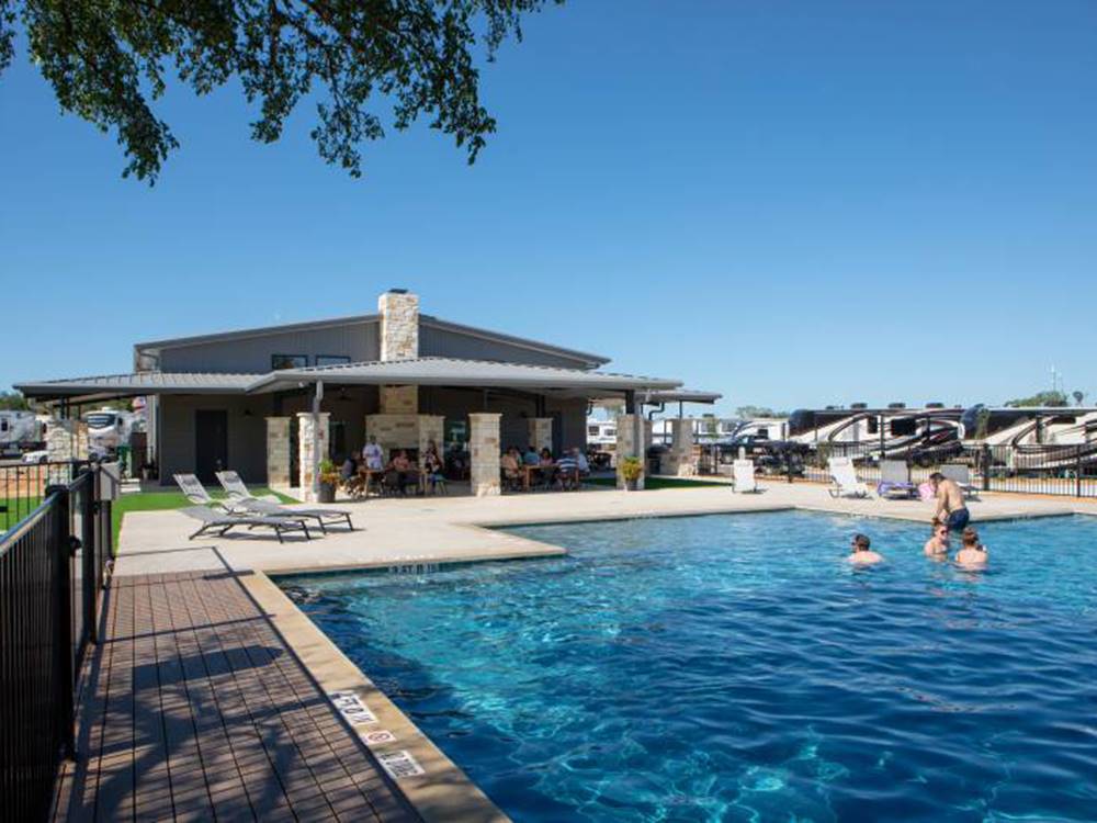 Guest enjoying the swimming pool at Jetstream RV Resort at Stone Oak Ranch