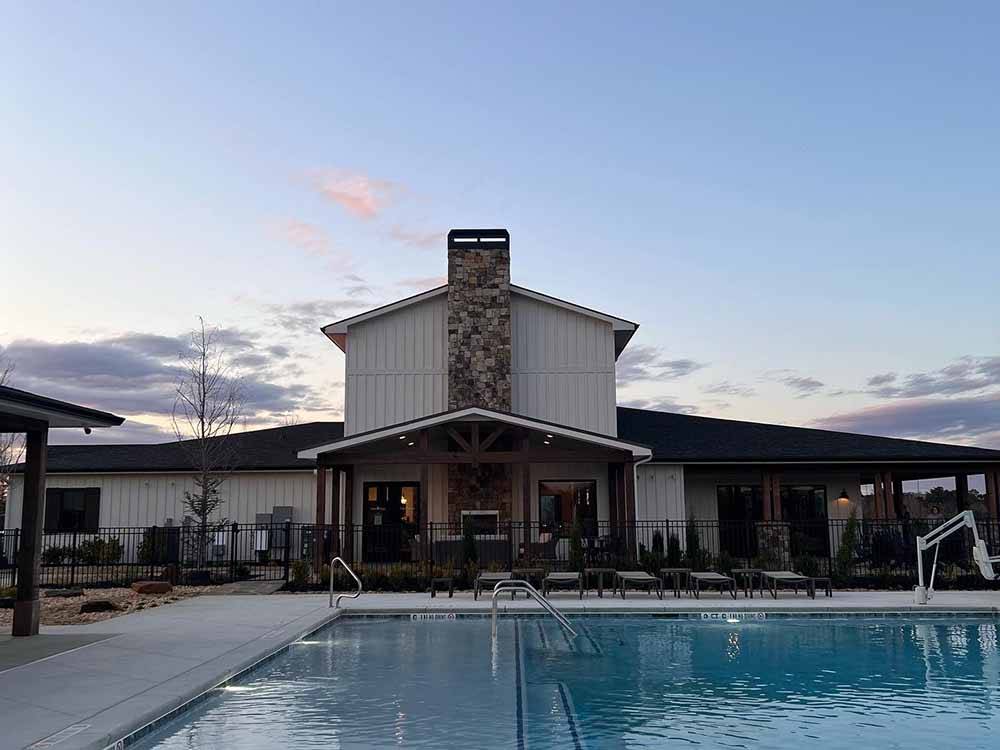 The swimming pool and clubhouse at TALONA RIDGE RV RESORT