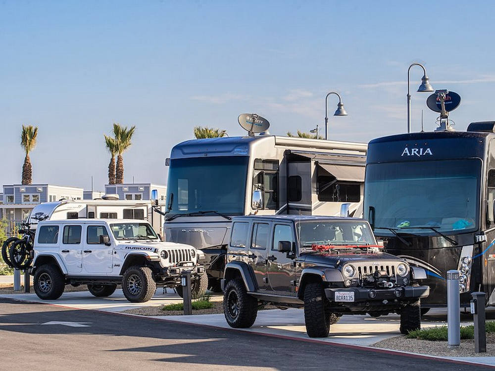 Jeeps next to rigs at Sun Outdoors San Diego Bay