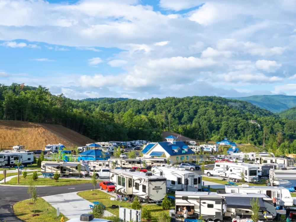 View of RV sites and tree covered hill at Camp Margaritaville RV Resort & Lodge